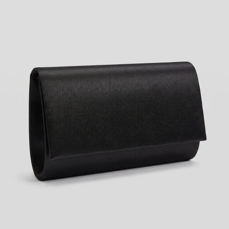 A standalone angled view of a black satin clutch with a structured rectangular envelope shape, a broad curved fold-over flap, rounded side gussets, and a boxy base. Layered edge seams or piping outline the flap and side openings, while the exterior has a fine crosshatch texture. No handles, straps, exterior pockets, hardware, logos, prints, patches, embroidery, or embellishments are visible.