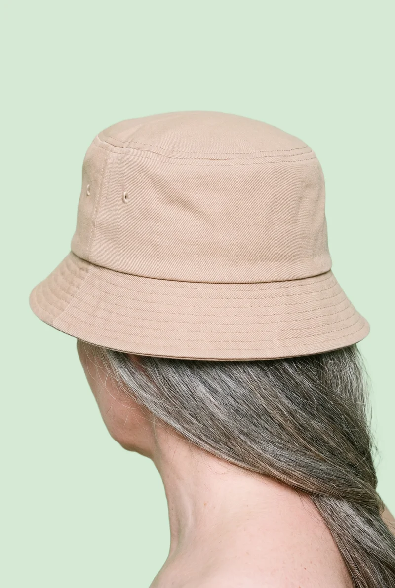 Women's Beige Bucket Hat, Head at Back, Studio Cutout lighting