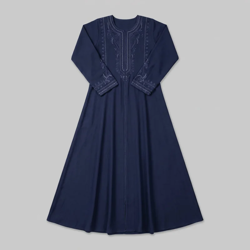 Navy full-length modest abaya laid flat in a mostly complete front view. It has a round neckline with a short center-front notch, structured shoulders, long straight sleeves, and a full-length center zipper bordered by a narrow vertical seam. The dress widens into an A-line flared skirt, with bold symmetrical scrolling floral and linear embroidery framing the neckline, front opening, vertical side-front lines, and sleeve cuffs.