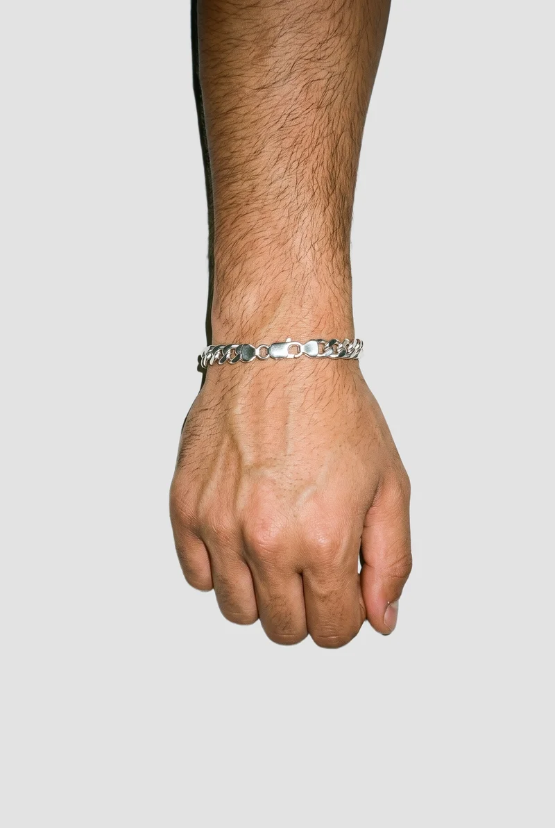 Men's Silver Chain Bracelet, Hand and wrist at Top, Studio Cutout lighting