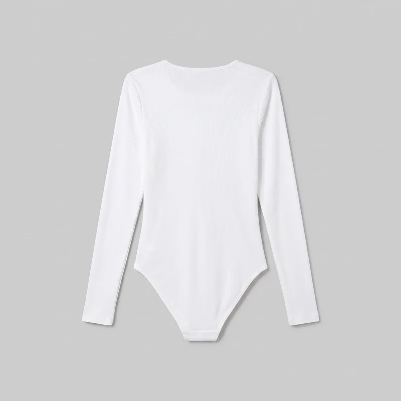 A white women’s ribbed long-sleeve bodysuit is shown as a standalone flat product view. The full shape is visible, including the slim body-skimming silhouette, rounded crew neckline with narrow binding, fitted sleeves, fine vertical ribbing, and tapered lower section with curved leg openings.