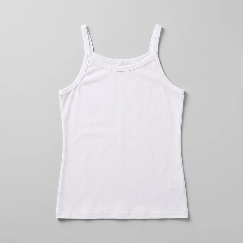 A white cotton camisole tank top is shown alone in a flat front view. It has narrow shoulder straps, a wide shallow scoop neckline, curved armholes, a slim body-skimming shape, and a straight full-length hem. Narrow bound edges with parallel stitching finish the neckline, straps, armholes, and hem, while the plain front has no closures, pockets, logos, prints, embroidery, or embellishments visible.