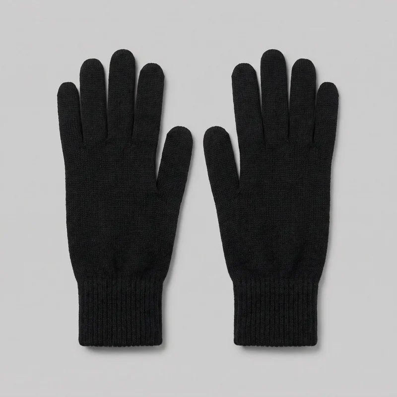 A complete pair of black full-finger knit gloves is shown flat. The gloves have a fitted hand shape, separate rounded fingertips, side-set thumbs, smooth knit bodies, and extended ribbed wrist cuffs with straight edges.