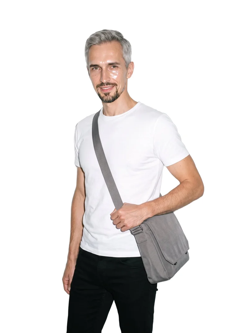 Grey Canvas Messenger Bag, Three-quarter length at Angled front, Studio Cutout lighting