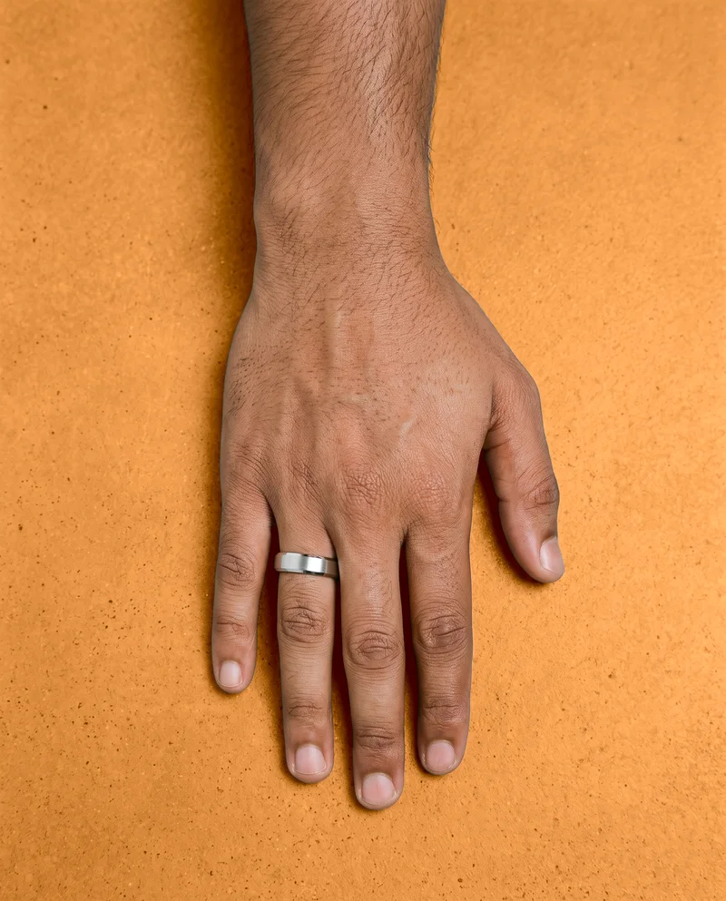 Men's Platinum Wedding Band, Hand and wrist at Top, Clean Catalog lighting