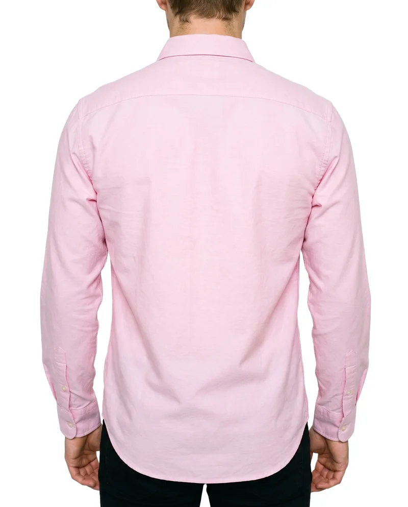 A male model is shown from the rear in a torso-length view wearing a pink Oxford shirt, with his arms relaxed. The shirt is presented against a pure white backdrop.