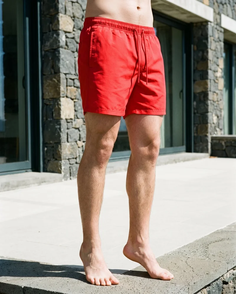 Red Swim Trunks, Lower body at Angled front, Clean Catalog lighting