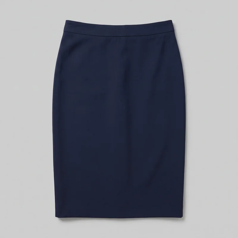 A navy pencil skirt is laid flat in a complete standalone view. The skirt has a slim, straight silhouette, a high-rise waist with a smooth flat waistband, a horizontal seam below the waistband, clean side edges, and a straight lower hem. No pockets, closure, logo, print, embroidery, or embellishment are visible.