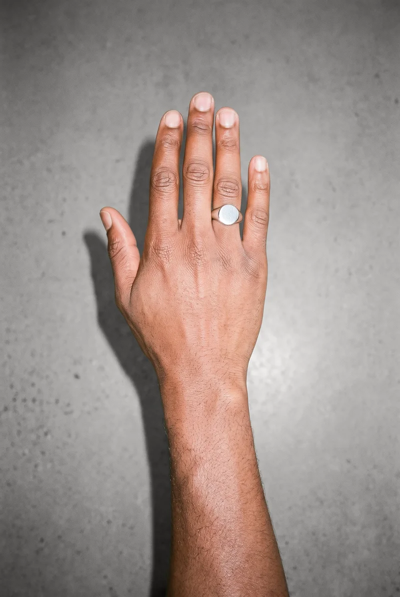 Silver Signet Ring, Hand and wrist at Top, Natural E-Commerce lighting