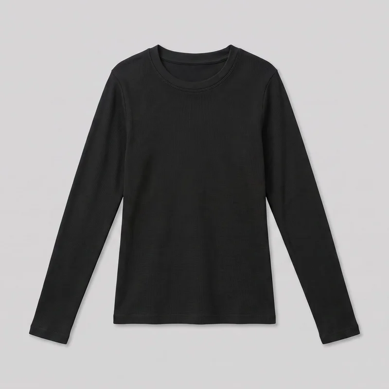 A standalone front view shows a black thermal top with fine all-over vertical ribbing, a round crew neckline with a narrow ribbed neckband and visible seam stitching, and long set-in sleeves tapering to plain wrist hems. The top has a slim, straight silhouette, a full-length body, shoulder seams at the top of the shoulders, and a straight hem with a narrow stitched band. No pockets, closures, logos, prints, patches, embroidery, or embellishments are visible.