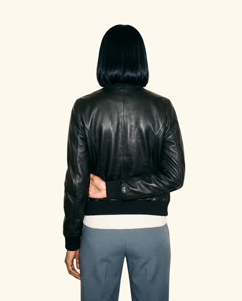 Women's Black Bomber Leather Jacket, Three-quarter length at Back, Studio Cutout lighting