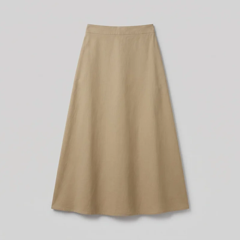 A khaki cotton maxi skirt is shown as a complete standalone product, laid flat or hanging against a plain background. It has a regular-fit A-line shape that narrows at the structured waistband and flares steadily to a wide straight hem, with horizontal seam lines and topstitching along the upper waist area and a stitched bottom hem. No closures, pockets, logos, prints, embroidery, or embellishments are visible.