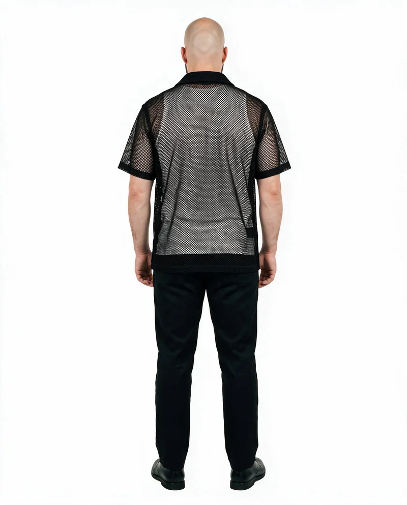 A 26-year-old Caucasian man stands straight in a full-body rear view wearing a men's black mesh cover-up. The garment is shown against a pure white backdrop.