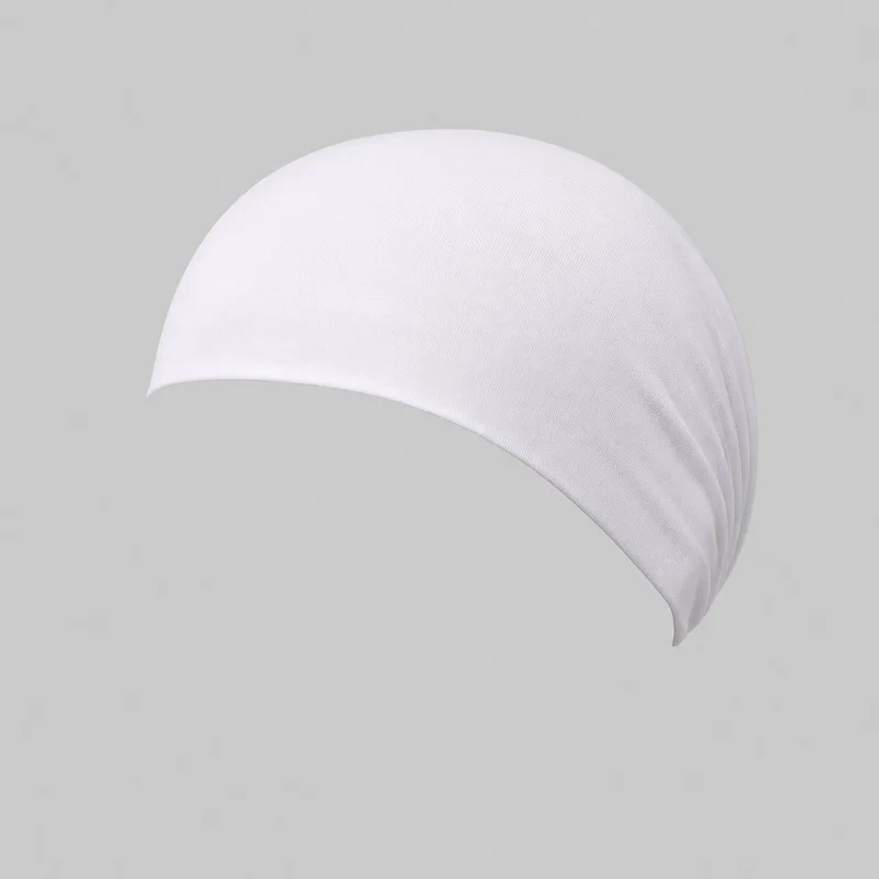 A white modal underscarf is shown alone in a standalone view, with its full fitted dome shape visible. It has a smooth curved front opening, a narrow finished edge, a tapered back, and gathered radiating folds for snug shaping. No closures, ties, logos, prints, embroidery, or embellishments are visible.
