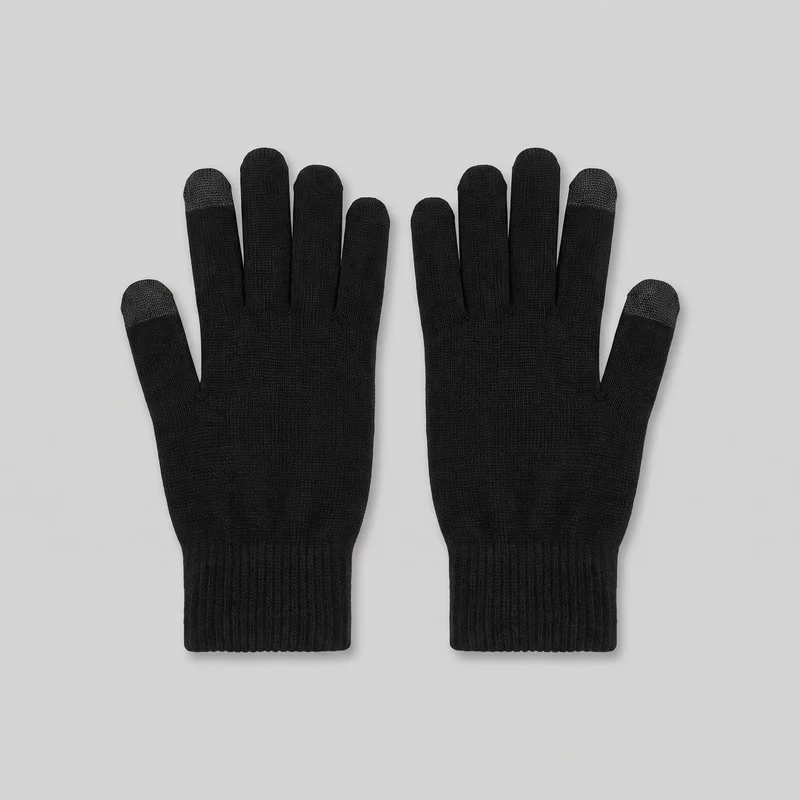 A matching pair of black full-finger knit gloves is shown as a standalone flat product view, laid palm-side or top-side up. The gloves have fitted silhouettes, individual rounded fingers, separate thumbs, fine vertical knit texture, and extended wrist-length cuffs with denser ribbing. Contrasting speckled conductive touch-panel areas are visible on the thumbs and index fingertips.