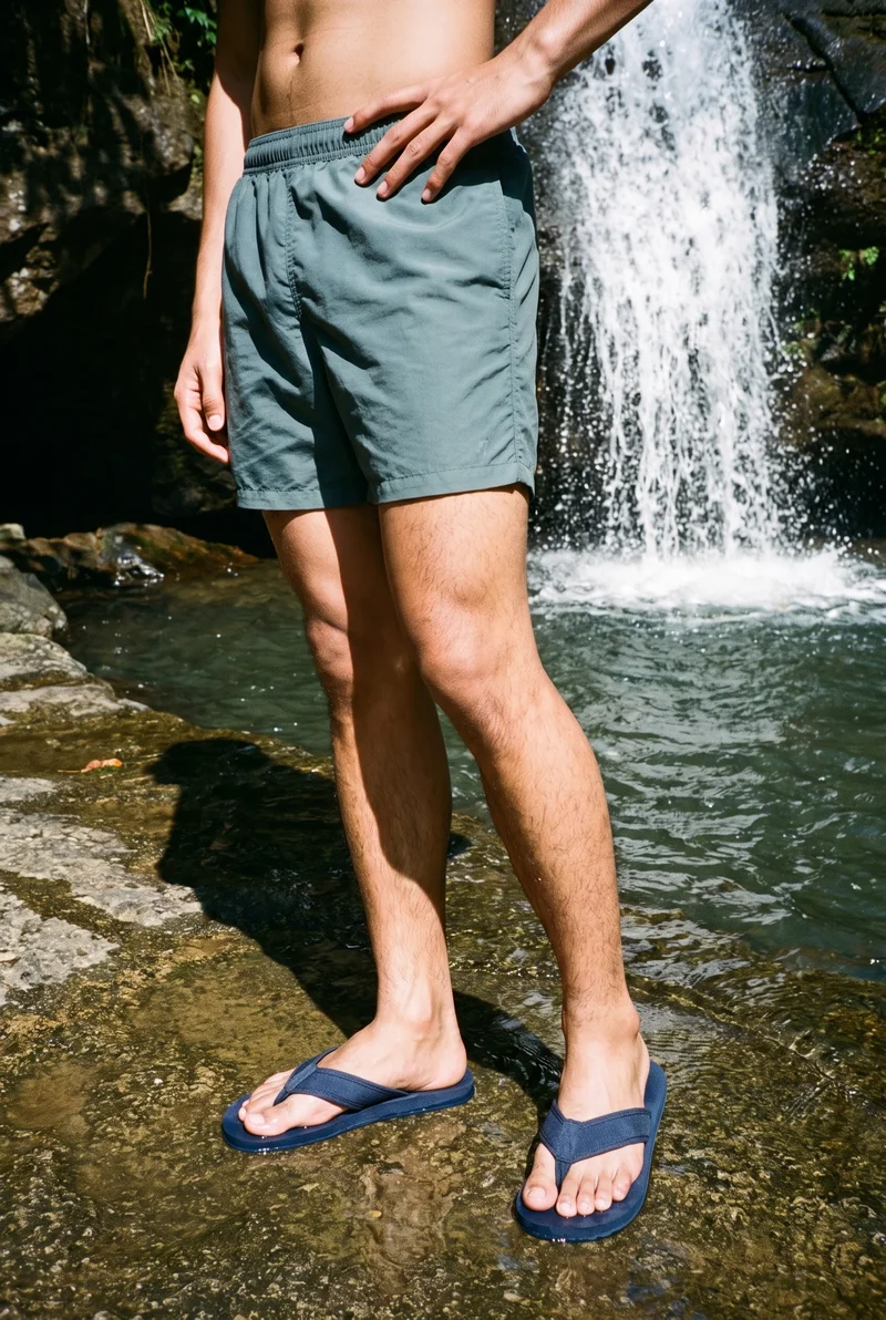 Men's Navy Flip-Flops, Lower body at Three-quarter, Flash Editorial lighting