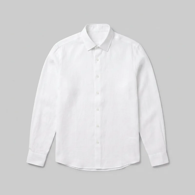 A mostly complete front view of a white linen shirt laid flat or product-styled. The shirt has a regular straight silhouette, fold-down pointed collar, visible front buttons, long sleeves with buttoned cuffs, set-in shoulders, and a gently curved shirttail hem. Its plain surface shows a subtle woven texture, with no visible chest pocket, logo, print, patch, embroidery, or embellishment.