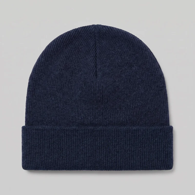 A mostly complete standalone view of a men's navy beanie. The close-fitting knit hat has a rounded crown, vertical ribbed texture, a visible seam running from the top center, and a wide folded cuff forming the lower band. No brim, closures, logos, prints, patches, embroidery, or other embellishments are visible.