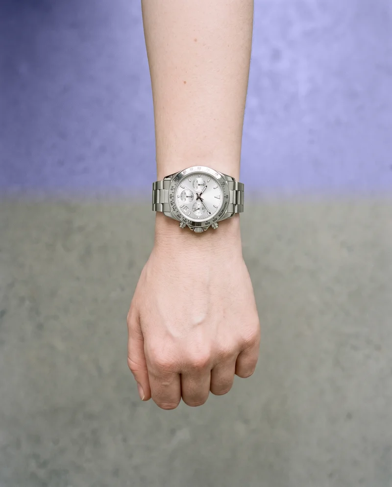 Women's Silver Chronograph Sports Watch, Hand and wrist at Top, Clean Catalog lighting