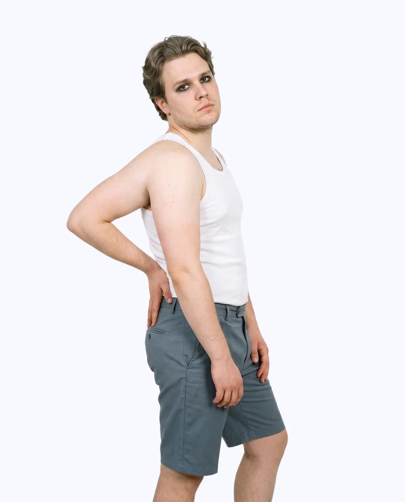 White Ribbed Vest, Three-quarter length at Side, Studio Cutout lighting