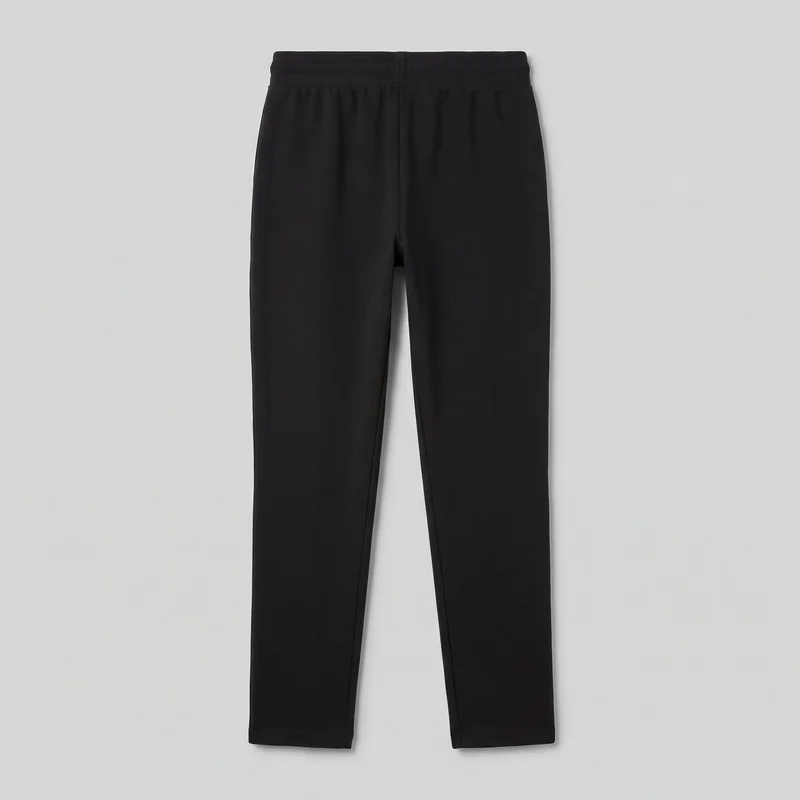 Women's black joggers shown in a front standalone view from the wide waistband to the full-length hems. The pull-on pants have a regular fit through the upper legs, tapered legs ending in straight hems, slight gathering below the waistband, and visible front rise, leg-seam, and hem stitching. No drawstring, fly closure, pockets, logos, prints, patches, embroidery, or embellishments are visible.