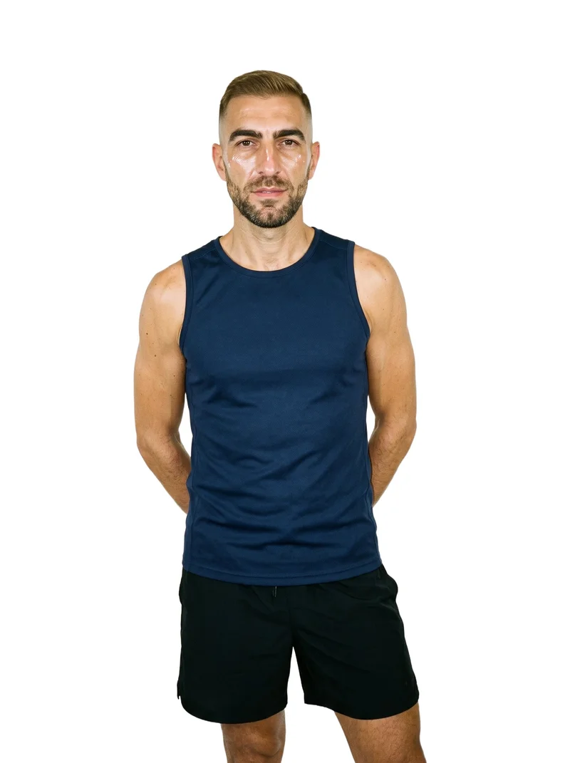 A 51-year-old Caucasian man wears a navy training tank in a front-facing three-quarter-length view. He stands with his hands behind his back and a neutral expression against a pure white backdrop.
