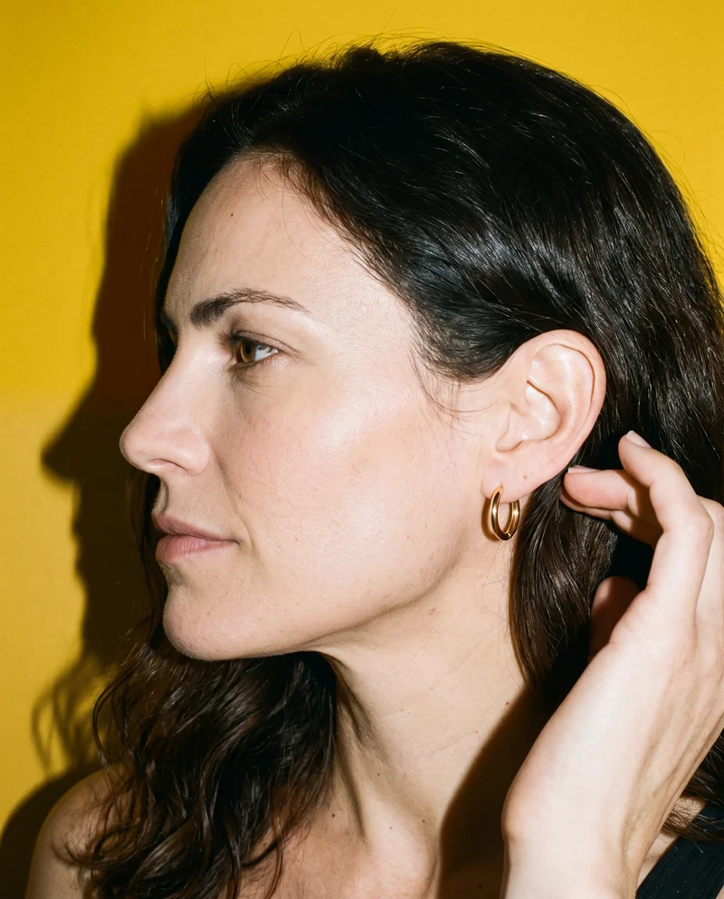 Women's Huggie Hoop Earrings, Ear at Side, Flash Editorial lighting