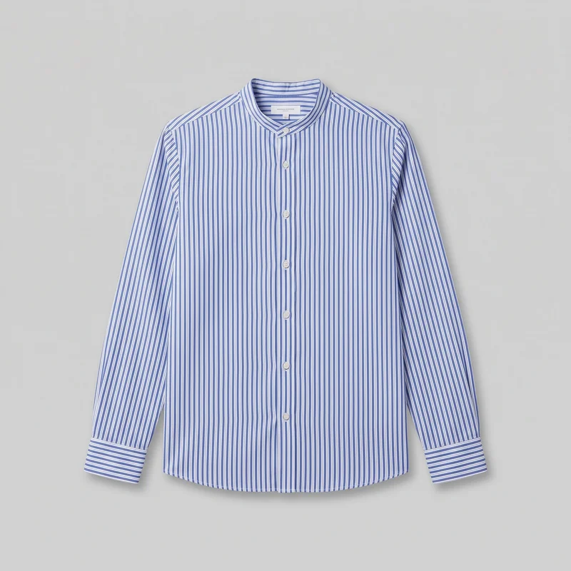 A standalone front view of a long-sleeve striped button-up shirt laid flat against a backdrop. The shirt has an all-over vertical stripe pattern, a regular straight silhouette, a band collar with layered seam edging, a centered exposed button placket with round buttons, wide button-style cuffs, and a gently curved hem.
