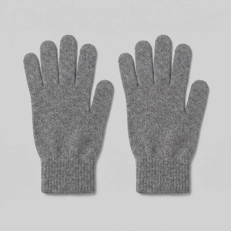 A complete pair of grey full-finger knit gloves is shown flat with the palms or backs of the hands facing upward. The gloves have rounded fingertips, separate thumb openings, straight ribbed cuffs, visible shaping seams around the finger bases and thumb joins, and an all-over fine heathered chevron knit texture.