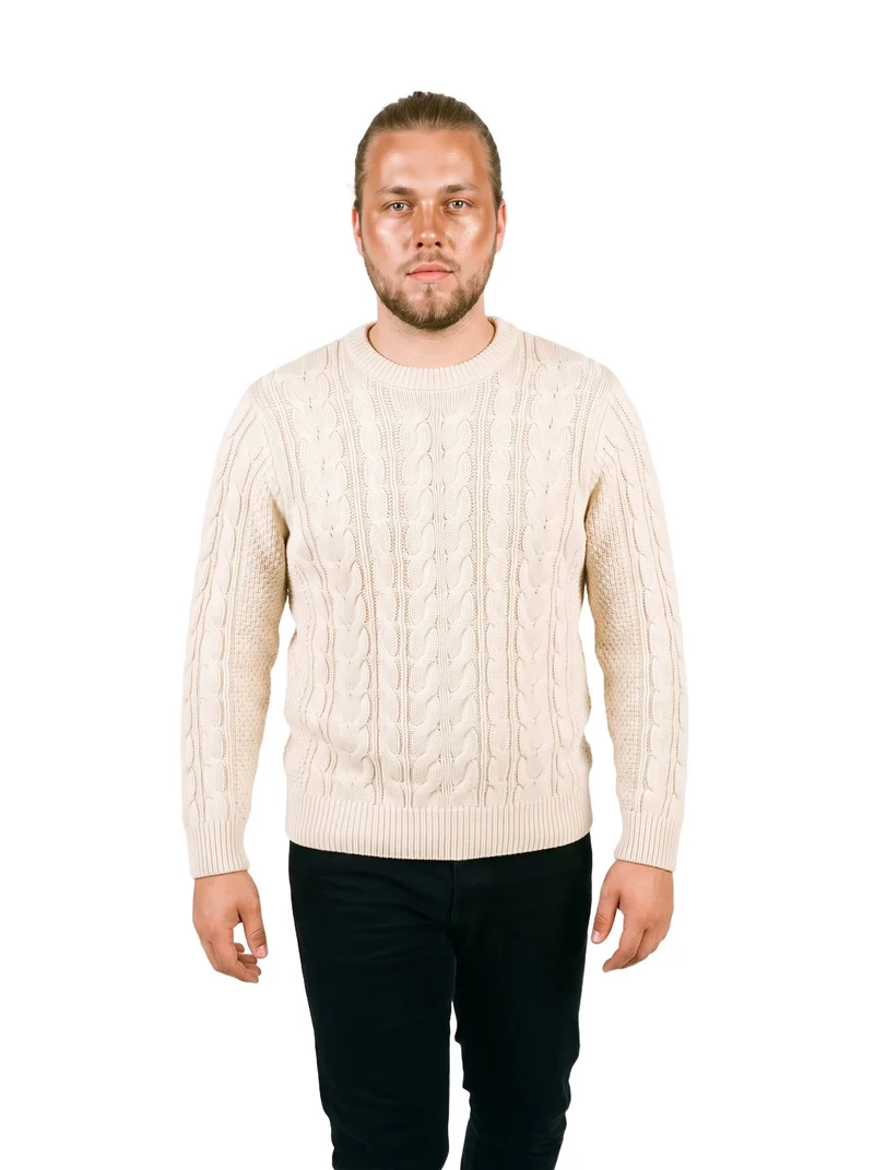 A 22-year-old Caucasian man wears a cream cable-knit pullover jumper in a front-view, three-quarter-length studio photograph. He is shown walking with a neutral expression against a pure white backdrop.