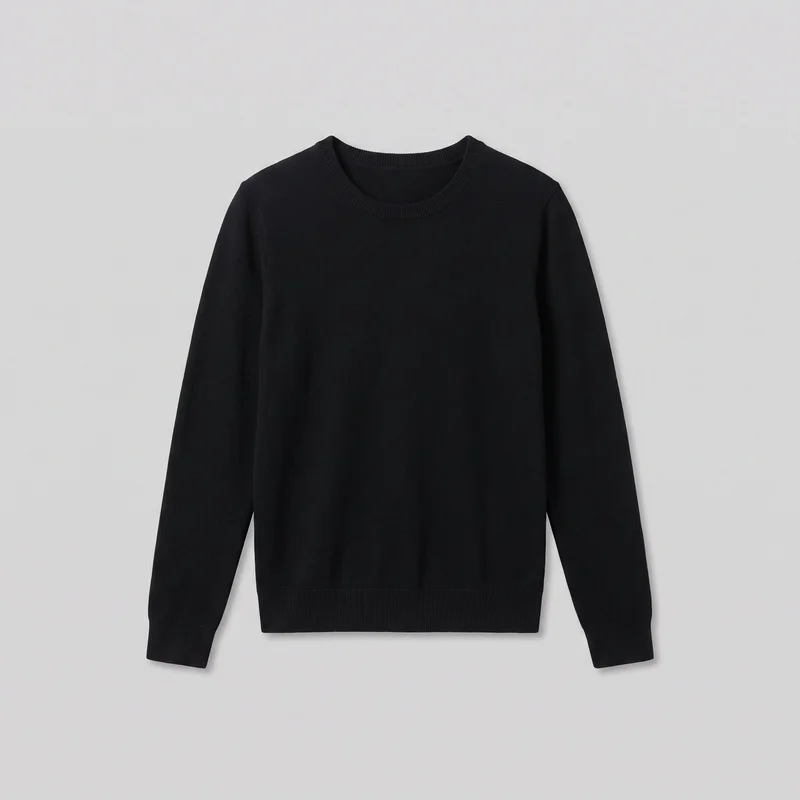 A mostly complete front view of a black women's crewneck knit pullover sweater laid flat. The sweater has a regular straight fit, full-length body, set-in shoulders, long sleeves with ribbed cuffs, a round ribbed neckline, and a straight ribbed bottom hem. Its front is plain, with no visible closures, pockets, logos, prints, embroidery, or embellishments.