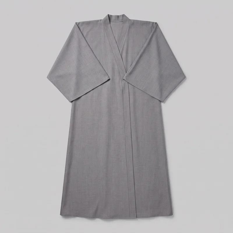 A grey kimono-style abaya robe is shown laid flat in a mostly complete, front-facing view. The full-length garment has a relaxed straight silhouette, an open V-front neckline, broad folded front panels, wide long sleeves with dropped angled shoulders, a vertical front overlap line, and a straight floor-length hem.
