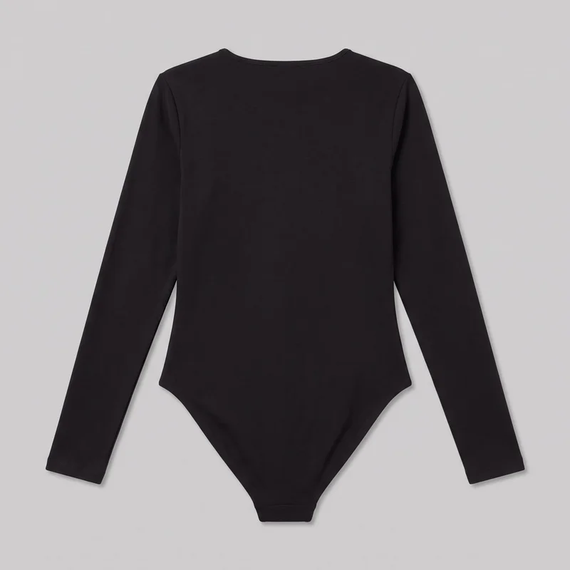 A black fitted long-sleeve bodysuit is shown as a mostly complete flat product view, displaying its back and outer shape. It has a shallow round neckline, straight full-length sleeves, and a high-cut lower body tapering to a narrow crotch panel, with narrow stitched binding along the neckline, cuffs, leg openings, and crotch edge.