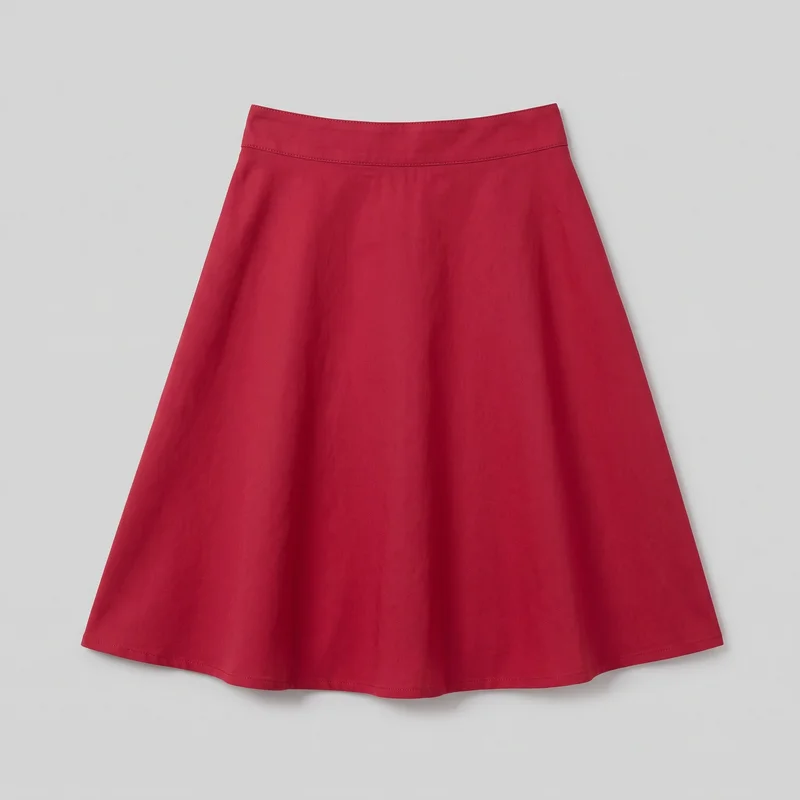 A complete red A-line skirt is shown flat against a backdrop in a front-facing view. It has a fitted wide waistband, a gently flared body with broad soft folds, and a curved hem with a narrow stitched finish.