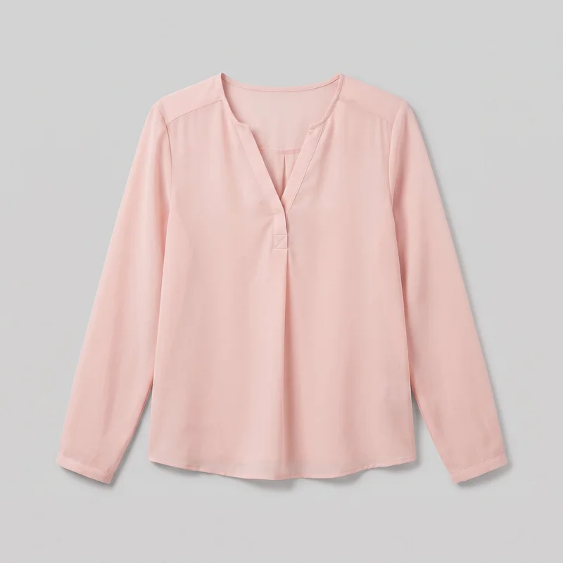 A blush pink chiffon blouse is shown laid flat in a mostly complete front view. It has a collarless split V neckline with narrow bound trim, a stitched front placket, and a small reinforced tab at the base of the opening. The long set-in sleeves have plain stitched sleeve bands, and the relaxed regular fit ends in a gently curved hip-length hem.