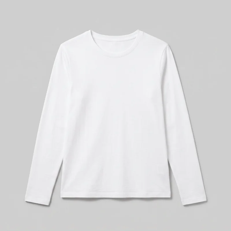 A plain white women's long-sleeve crewneck T-shirt is shown laid flat in a mostly complete front view. It has a regular fit, shoulder seams, full-length set-in sleeves with straight openings, a narrow bound neckband, and a straight hip-length hem with stitched finishing. The front has no closures, pockets, logos, prints, patches, embroidery, or other embellishments.