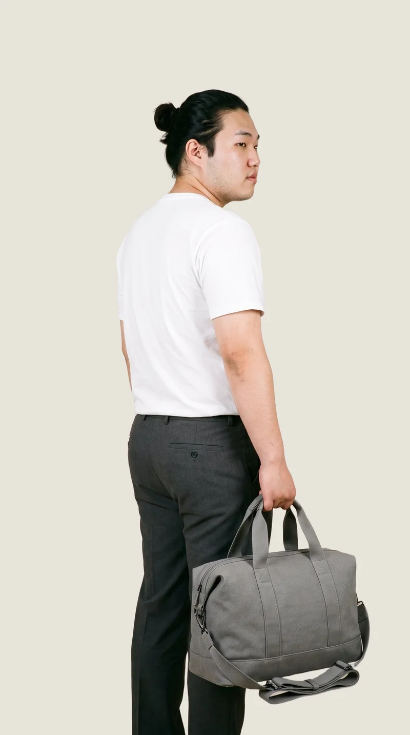Grey Weekend Bag, Three-quarter length at Angled rear, Studio Cutout lighting
