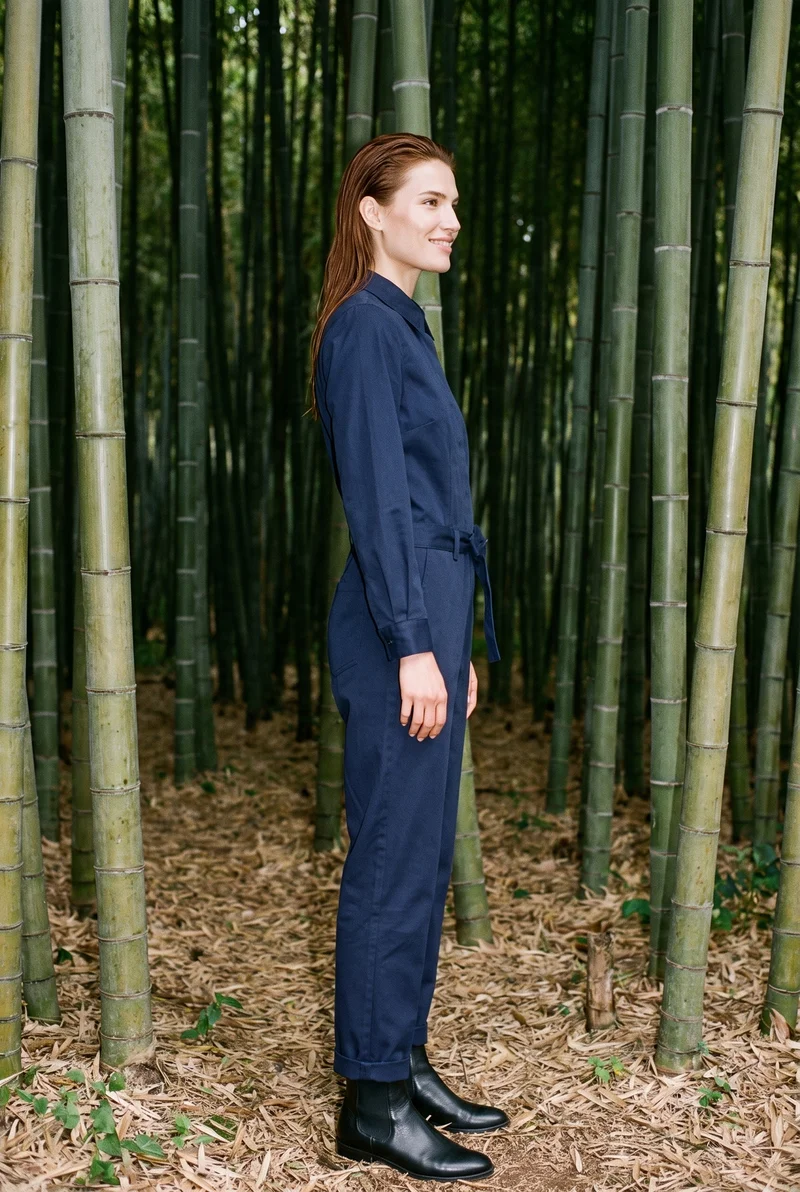 Navy Tailored Jumpsuit, Full body at Side, Clean Catalog lighting