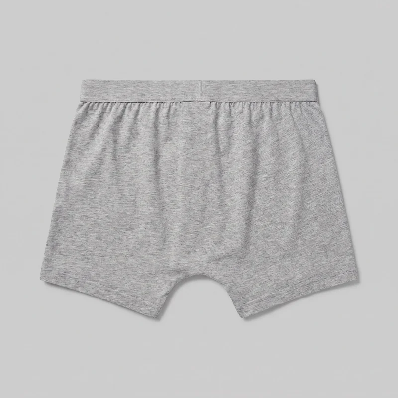 Grey marl men's boxer-brief underwear shown as a flat standalone product, displaying the full relaxed short-leg silhouette, mid-rise straight elastic waistband with a centered vertical seam, gathered fabric below the waistband, arched crotch opening, and double-stitched leg hems. No fly closure, pockets, logos, prints, patches, embroidery, or embellishments are visible.