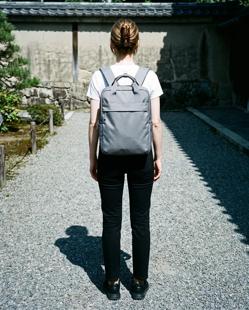 Women's Grey Laptop Backpack, Full body at Rear, Flash Editorial lighting