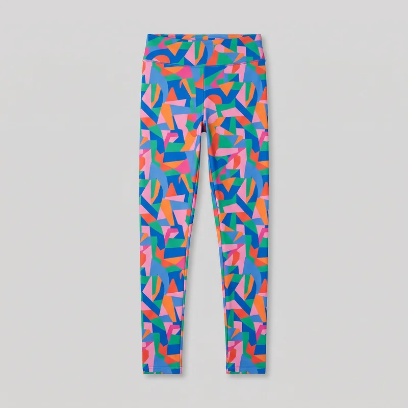 Printed leggings laid flat in a full standalone front view. They have a slim bodycon fit, a high-rise wide waistband, full-length narrow straight legs, a horizontal seam below the waistband, visible topstitching at the waistband and ankle hems, a centered front rise seam, and inner leg seams. A bold all-over abstract geometric print covers the waistband and legs.