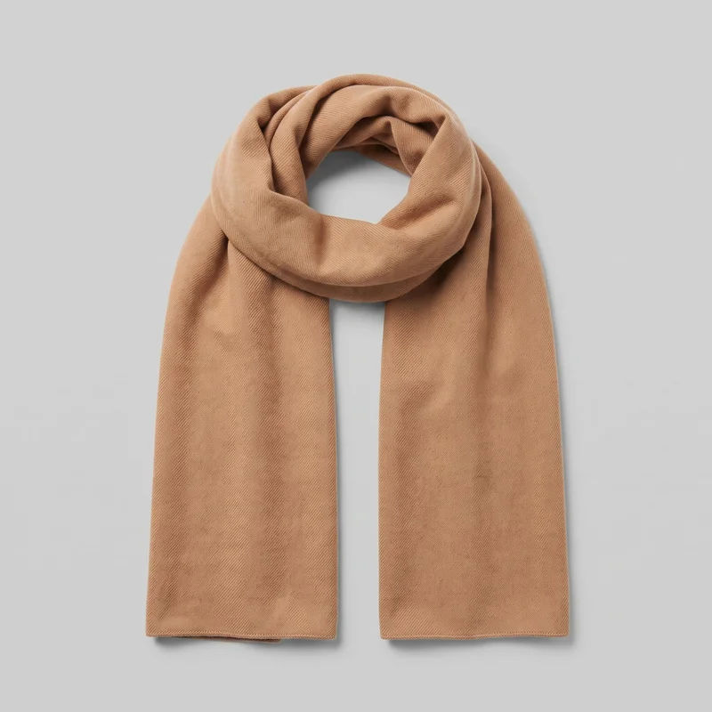 A rectangular camel cashmere scarf is shown as a standalone product, draped into a loose loop with two straight ends hanging downward. Its broad, flat form has softly folded volume through the loop, a fine woven texture with subtle diagonal variation, and narrow finished edges with stitched hems. No logos, prints, patches, embroidery, or embellishments are visible.
