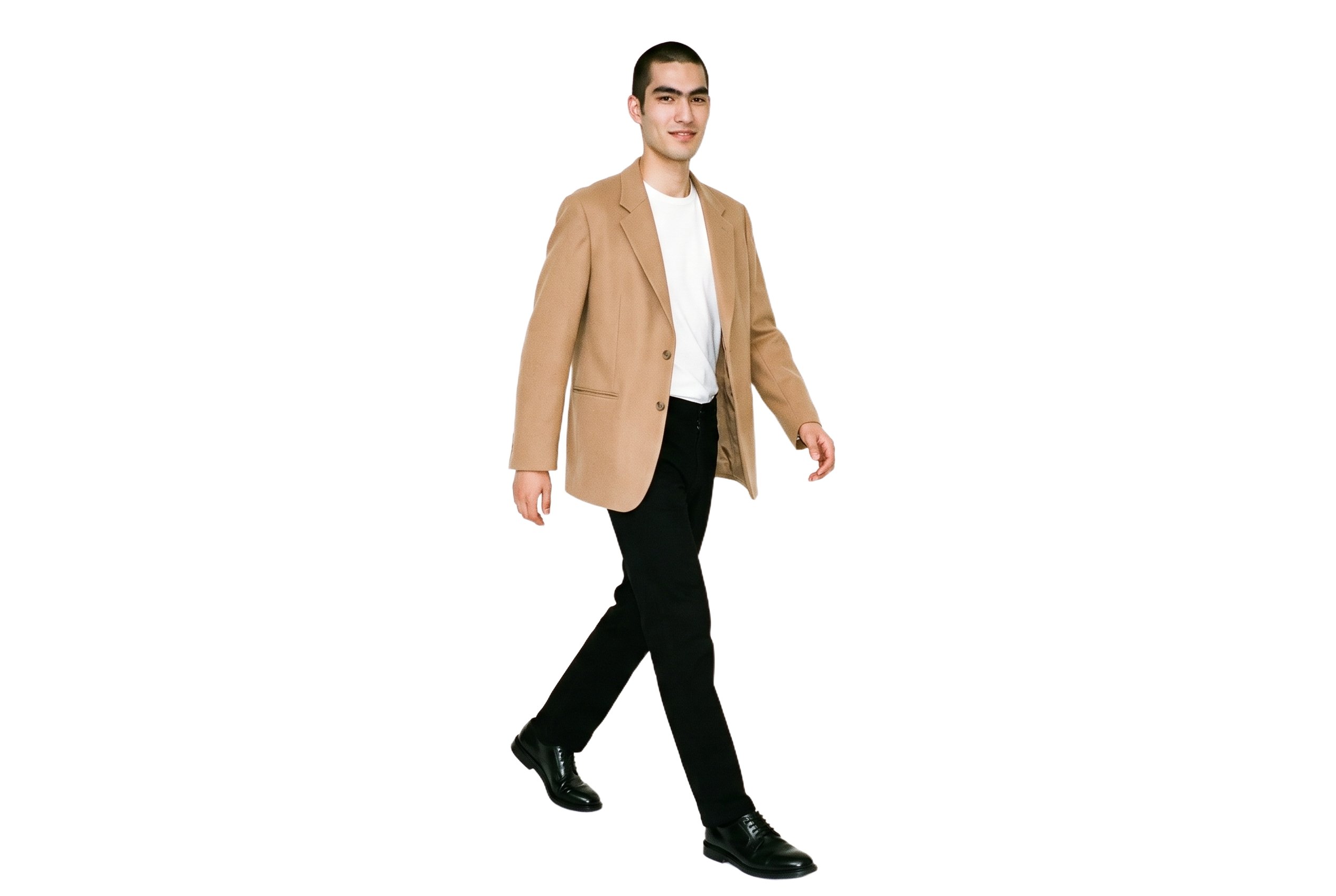 A 23-year-old Japanese male model is shown full body from an angled front view while walking naturally, wearing a men's camel oversized blazer. The image uses a pure white backdrop.